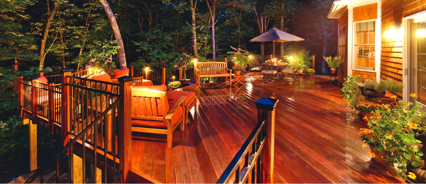 A deck with chairs and umbrellas